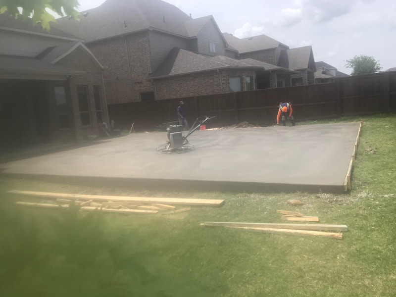 Concrete basketball court in progress