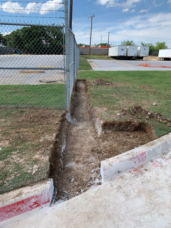 Trench dug for concrete gate tracks